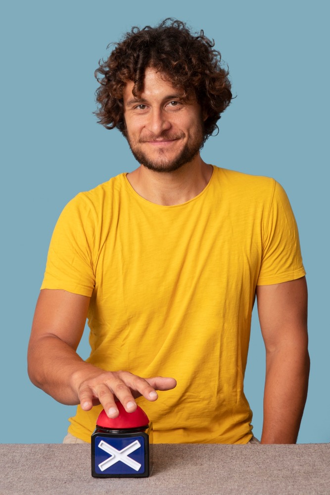 young adult pressing buzzer button